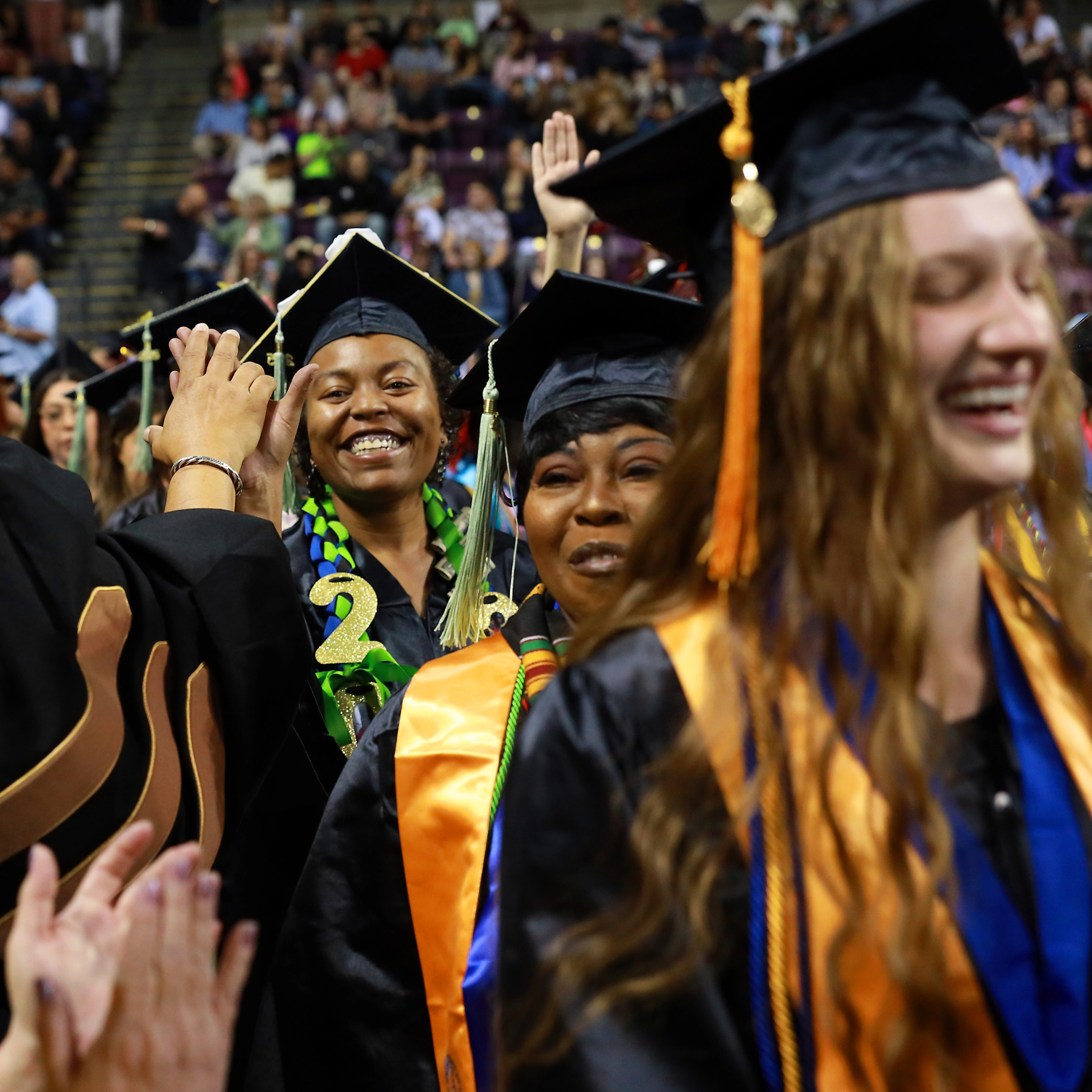 graduates walking in to commencement