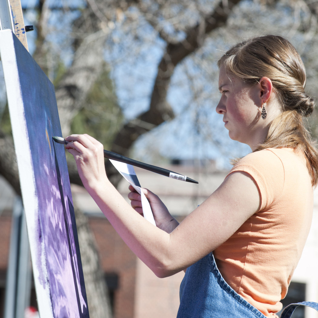 Student painting outside